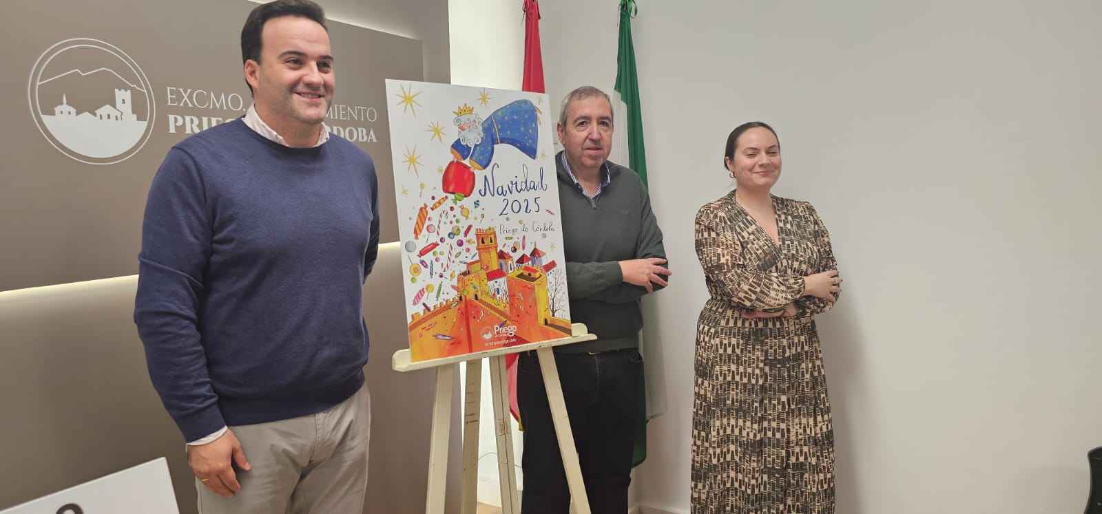 Valdivia, Navas y Ramírez junto al cartel de la Navidad 2025.